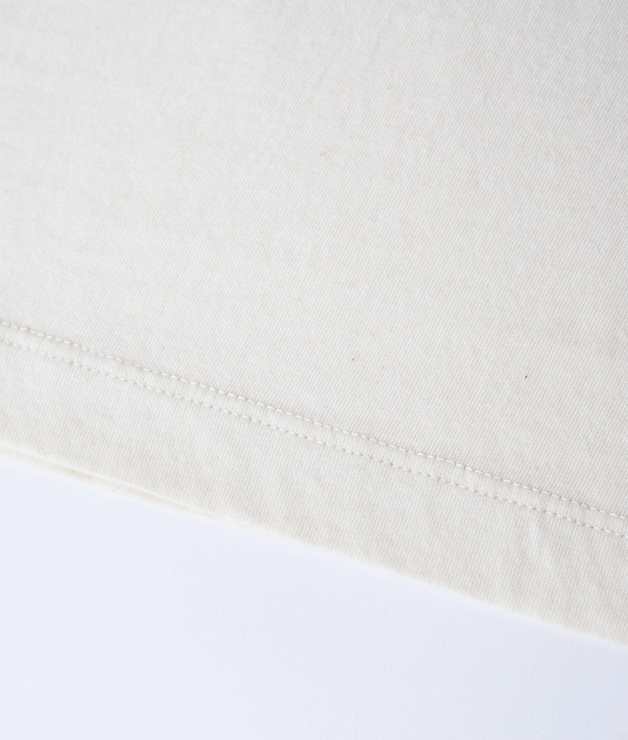 White cotton t-shirt texture and stitching detail - Industry of All Nations