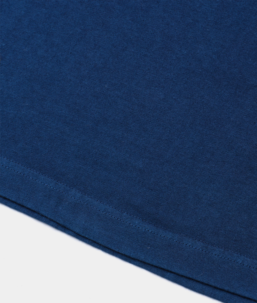 Blue organic cotton t-shirt, flat lay shot on white background - Industry of All Nations