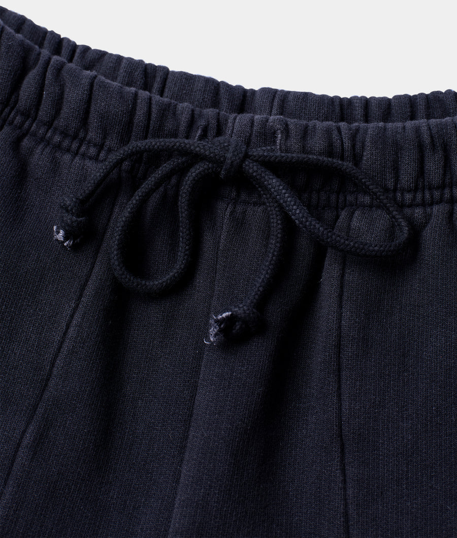Close-up shot of black organic cotton drawstring sweatpants with elastic waistband - Industry of All Nations