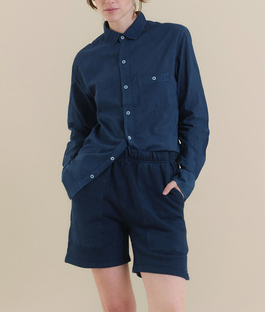 Navy blue button-down shirt and shorts outfit worn by model - Industry of All Nations