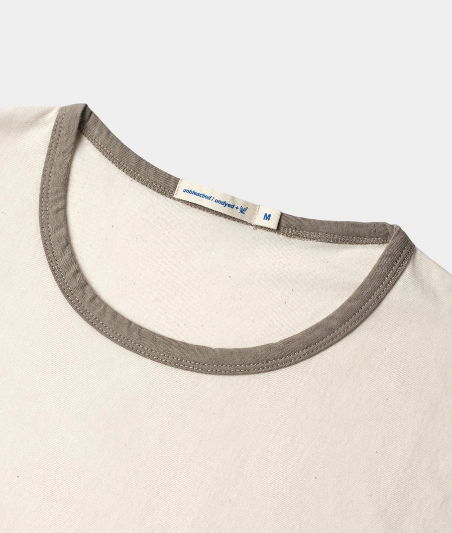 Close-up of IOAN Undyed Sport Crewneck T-shirt with Iron 4 ribbed neckline, showing the inner neck label.