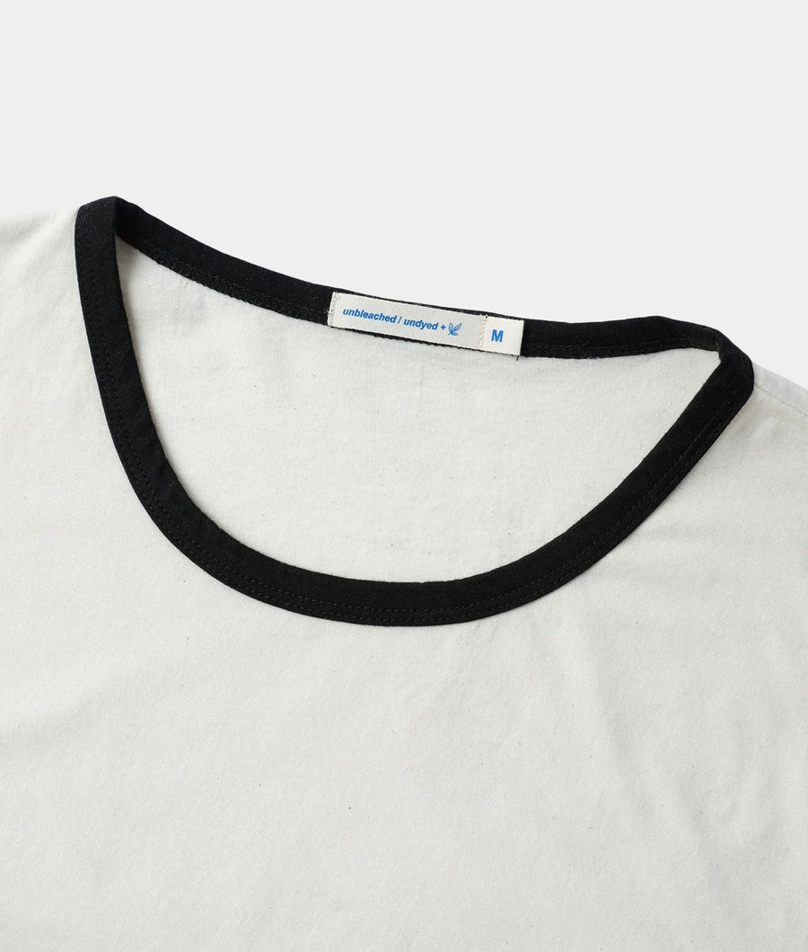 Close-up of IOAN Undyed Sport Crewneck T-shirt with Iron 8 ribbed neckline, showing the inner neck label.