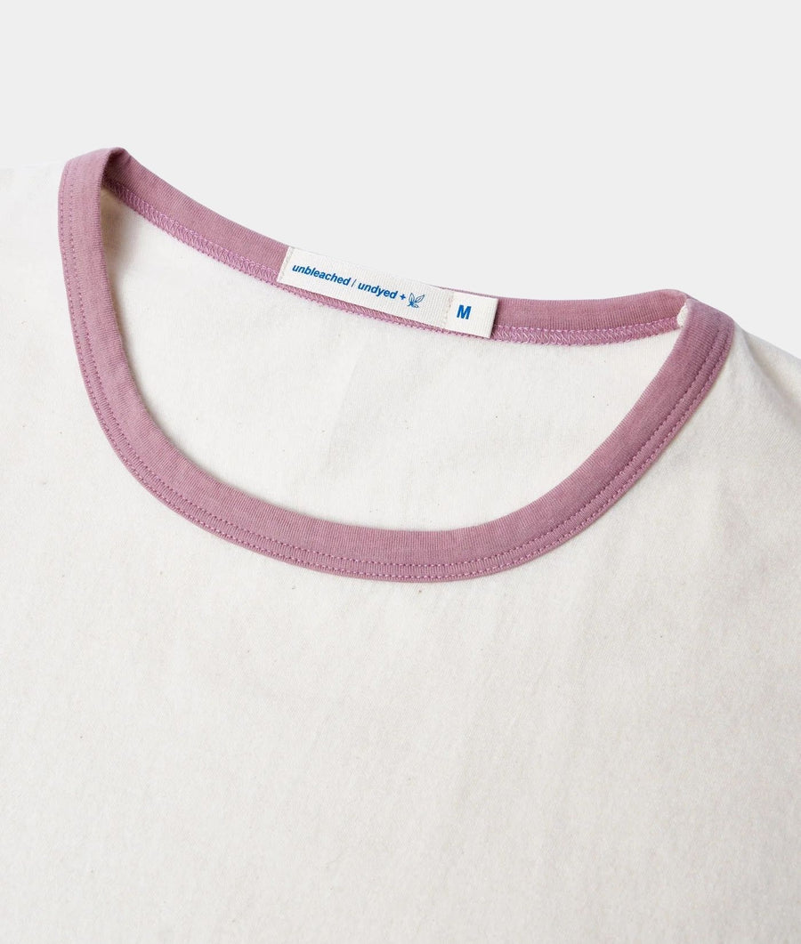 Close-up of IOAN Undyed Sport Crewneck T-shirt with Shellac ribbed neckline, showing the inner neck label.