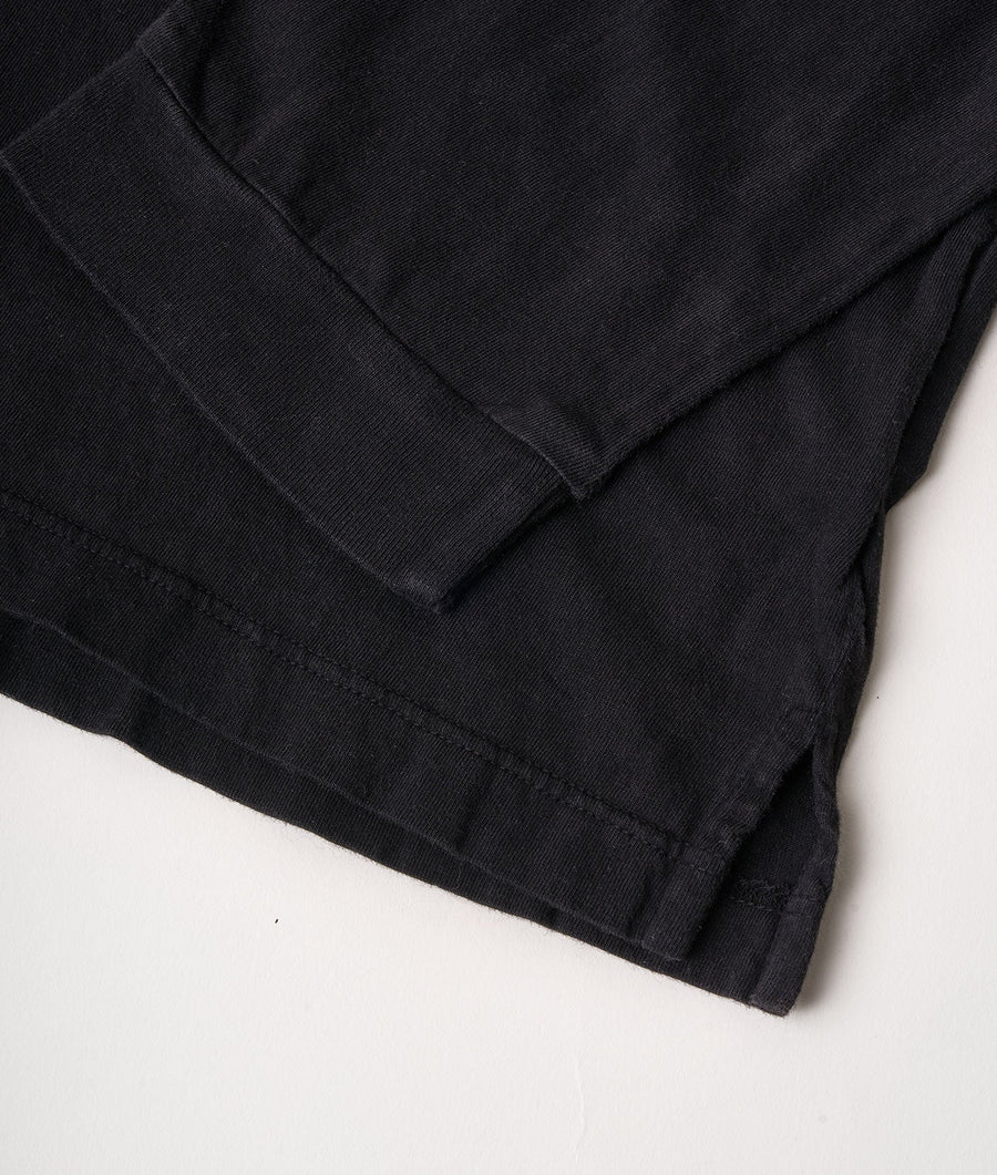 Folded black cotton trousers with stitching detail - Industry of All Nations