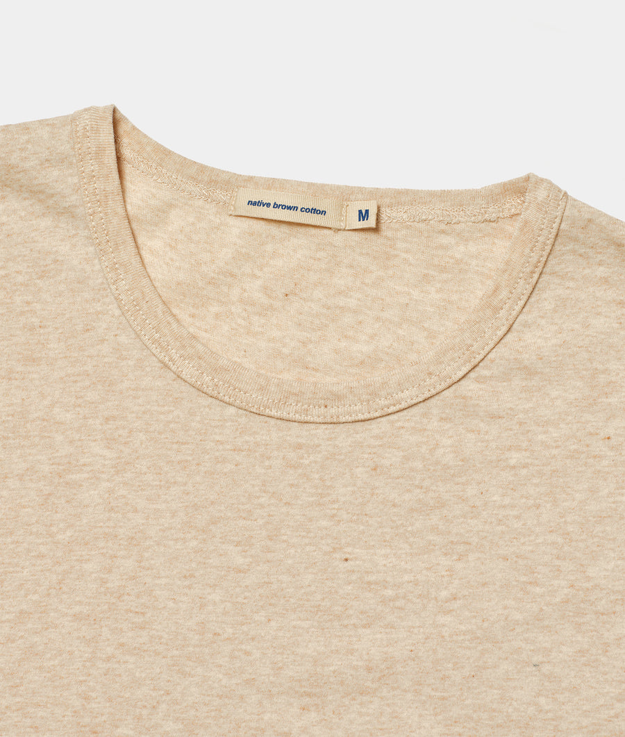 Beige cotton crew neck t-shirt, close-up of neck and shoulder details - Industry of All Nations