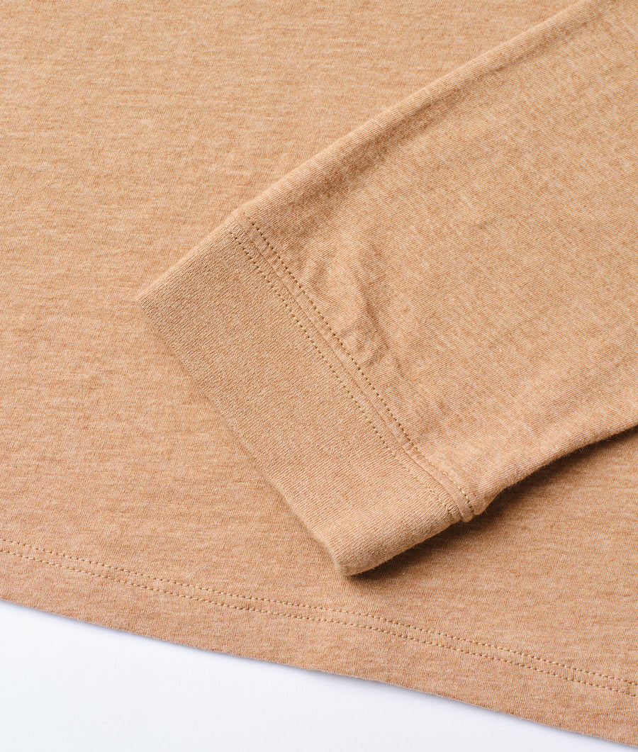 Beige cotton t-shirt with crew neck, displayed in a detail shot showing the fabric texture and stitching - Industry of All Nations