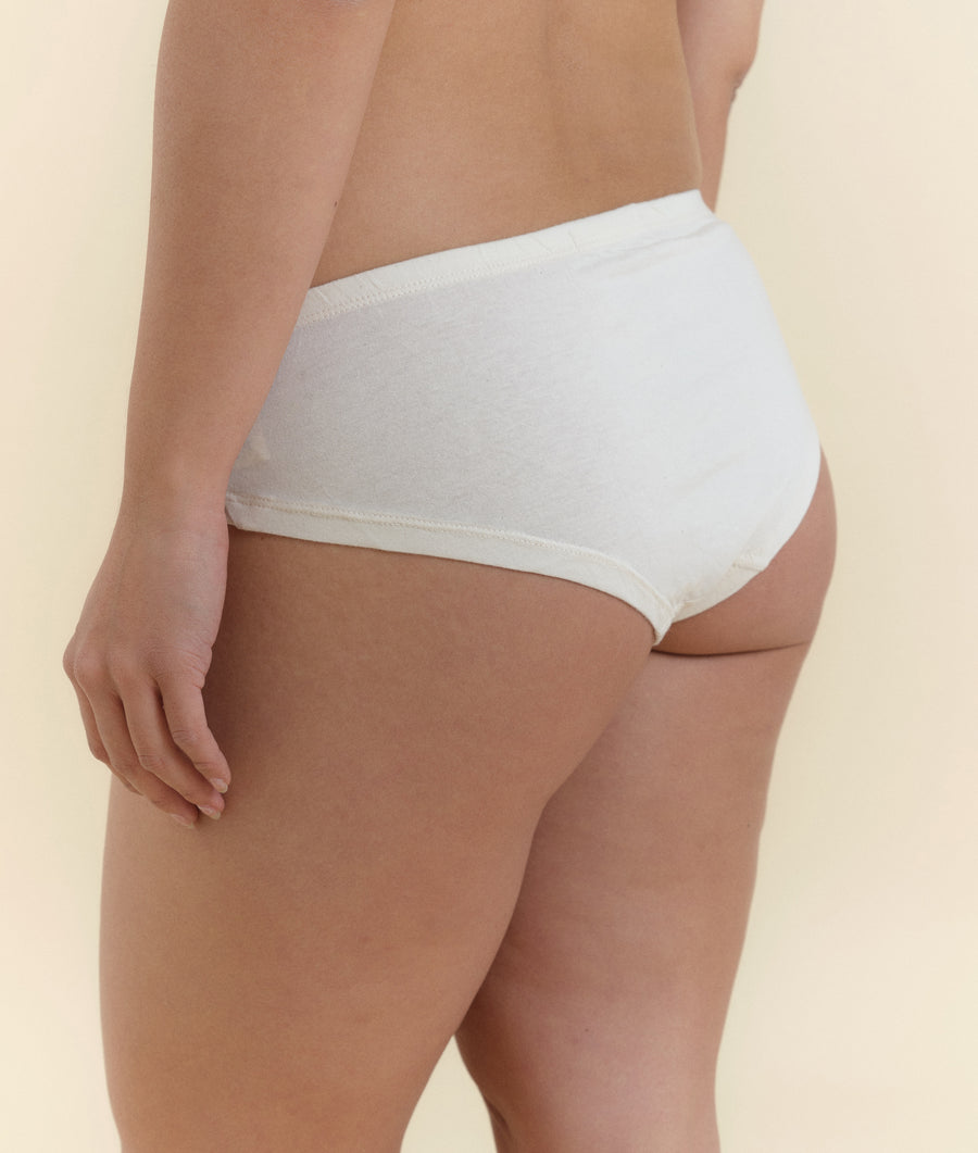 White organic cotton high-cut briefs worn on model - Industry of All Nations