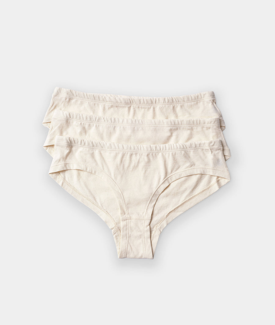 Tan women's high-waisted underwear with ruffle details, displayed in a flat lay against a white background - Industry of All Nations