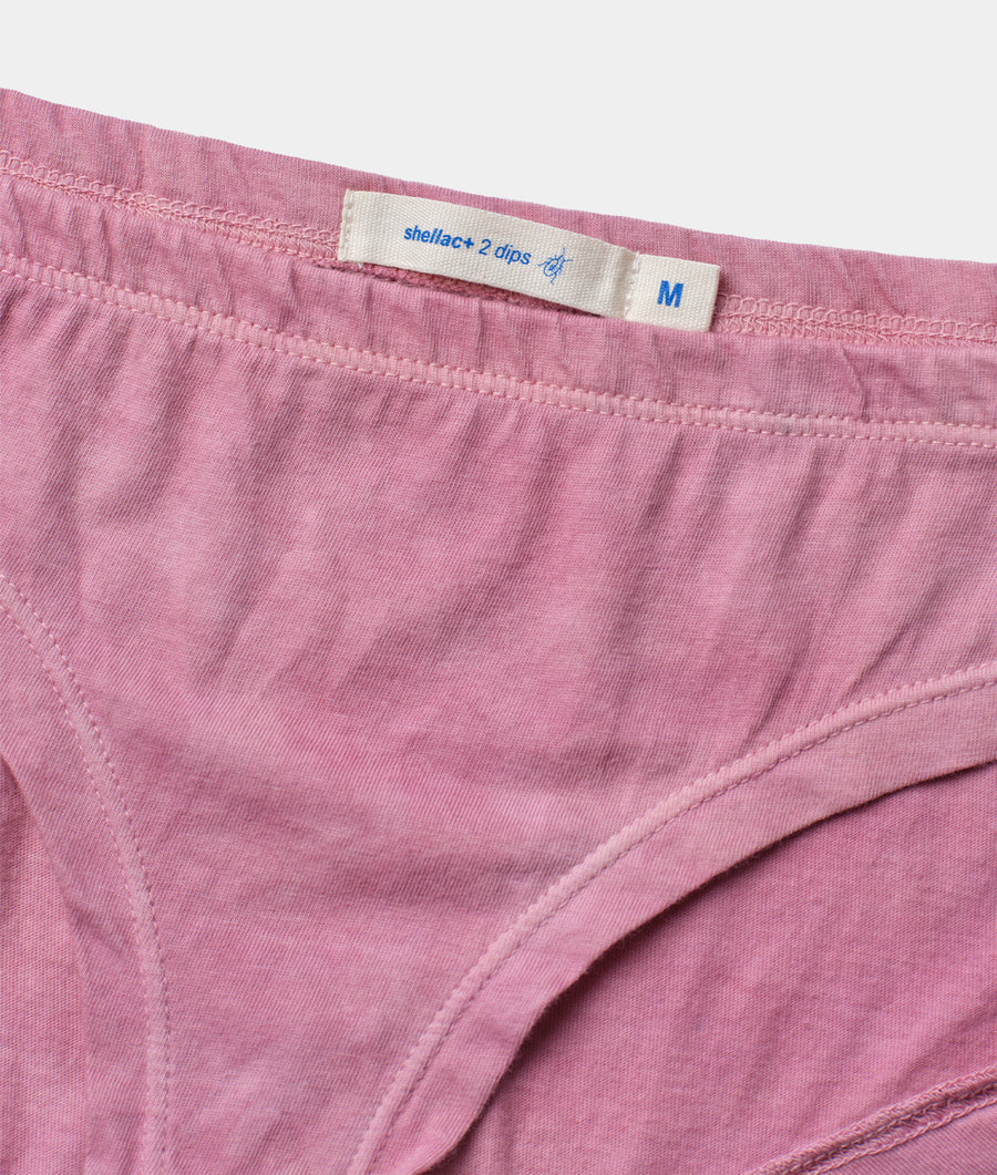 Detail shot of pink organic cotton underwear with "Shellac+ 2 dips" label - Industry of All Nations