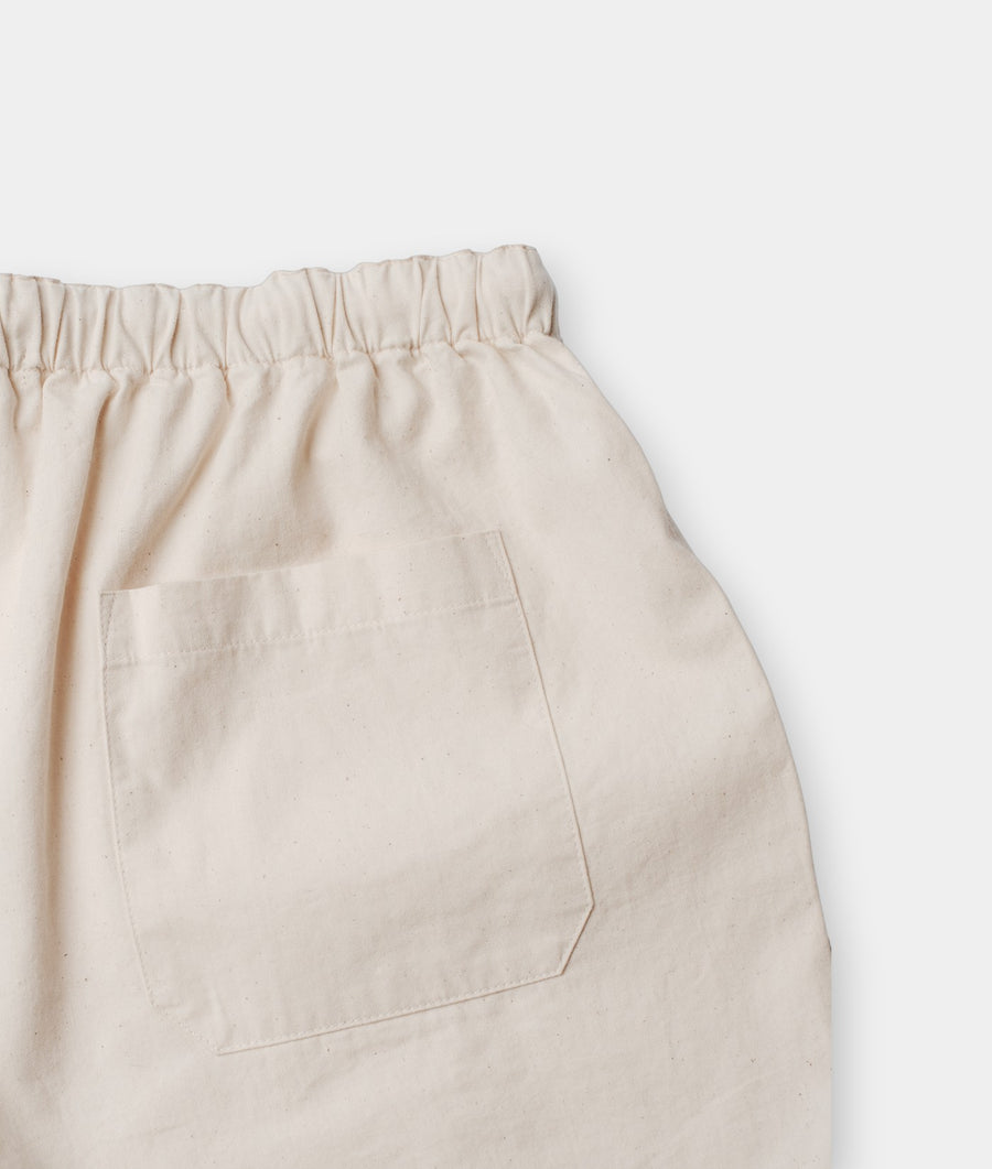 Back patch pocket and elasticated waist on undyed natural cotton women's Ponya shorts - Industry of All Nations