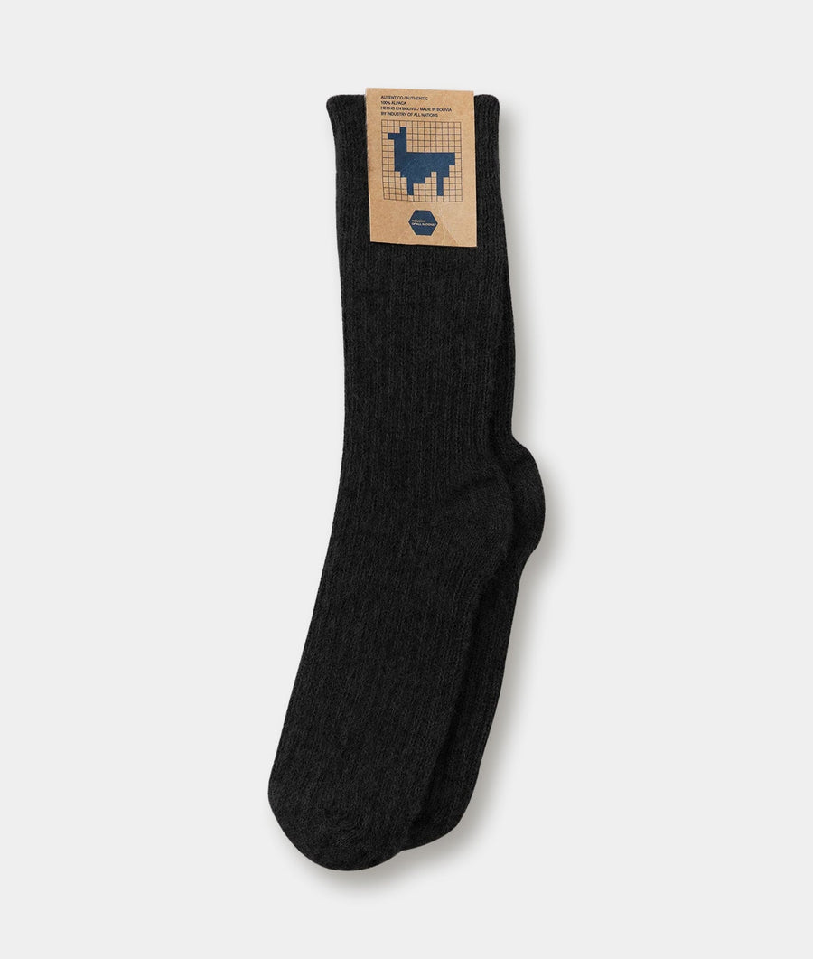 Black wool socks with llama graphic design displayed on a white background - Industry of All Nations