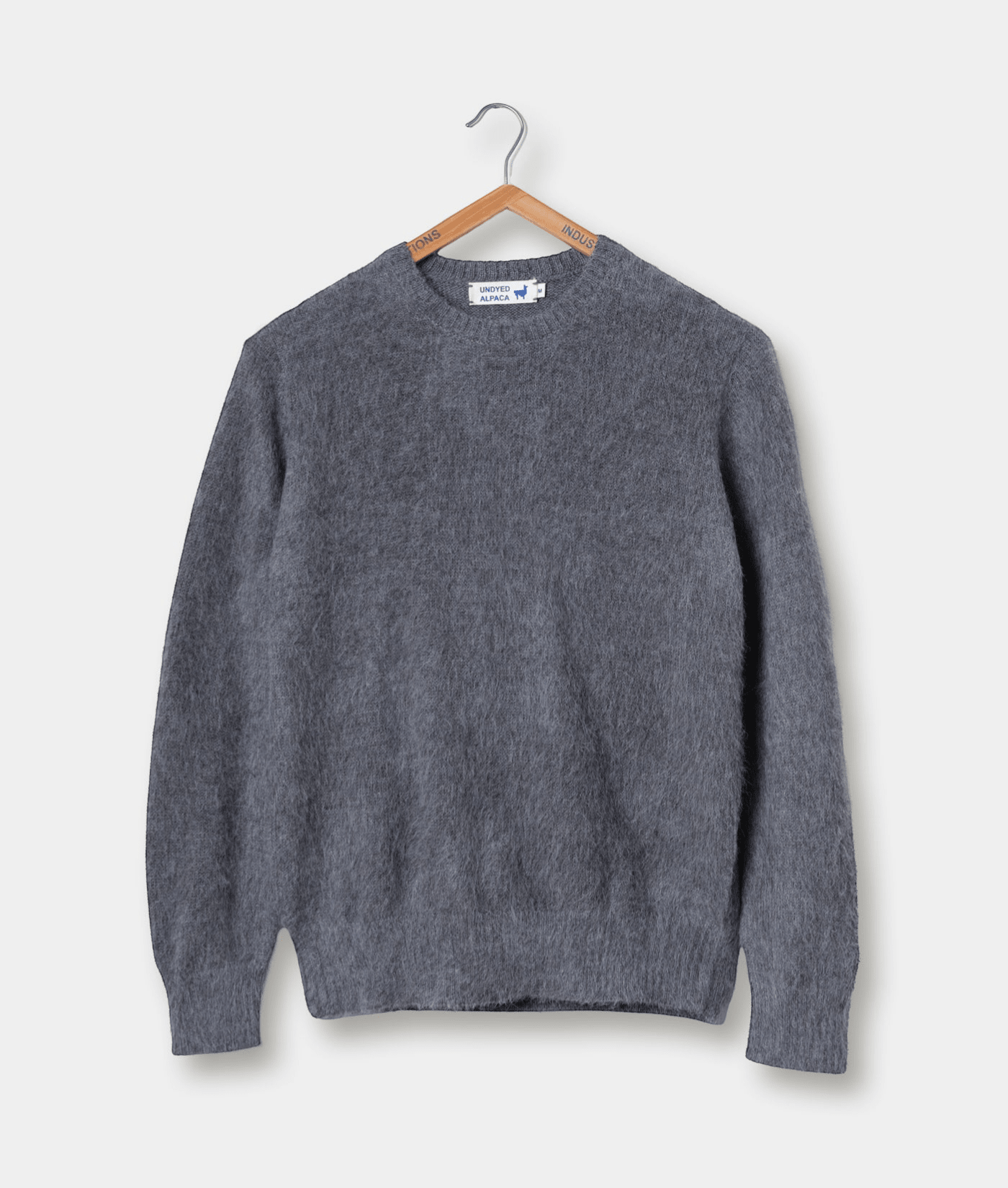 Gray wool sweater displayed on a wooden hanger - Industry of All Nations