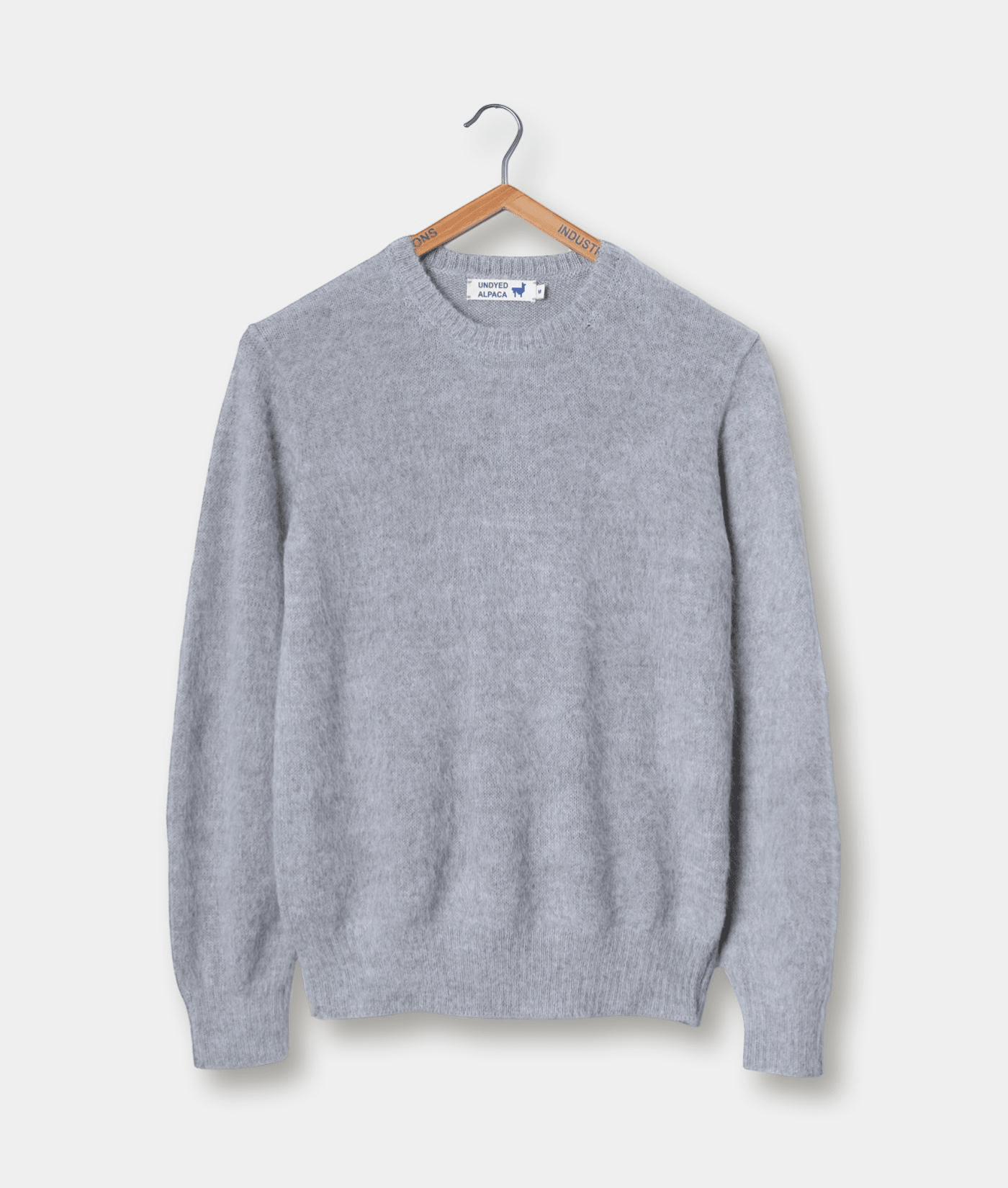 Gray crew neck sweater displayed on a wooden hanger - Industry of All Nations
