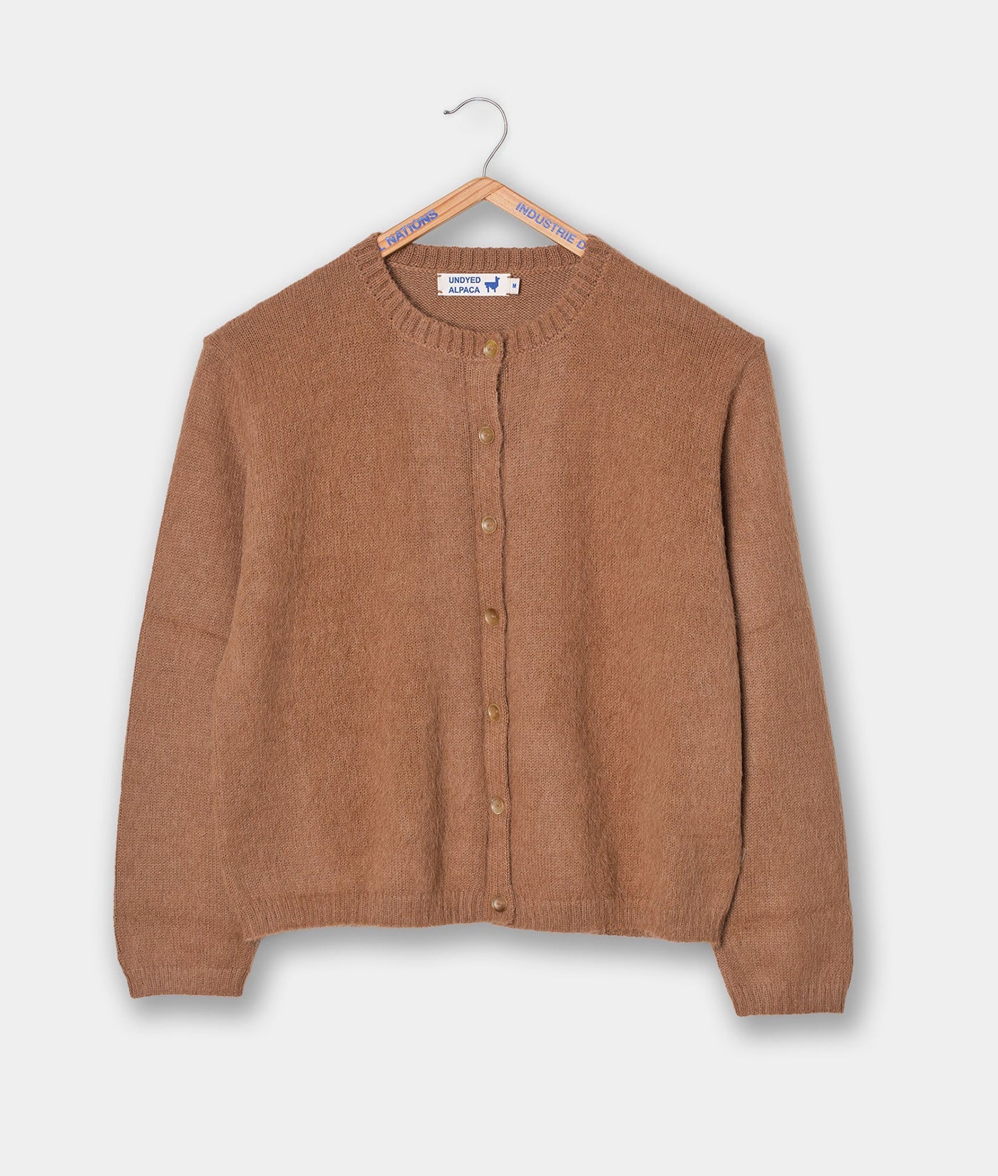 Tan knit cardigan sweater with button-up front, displayed flat on a hanger - Industry of All Nations