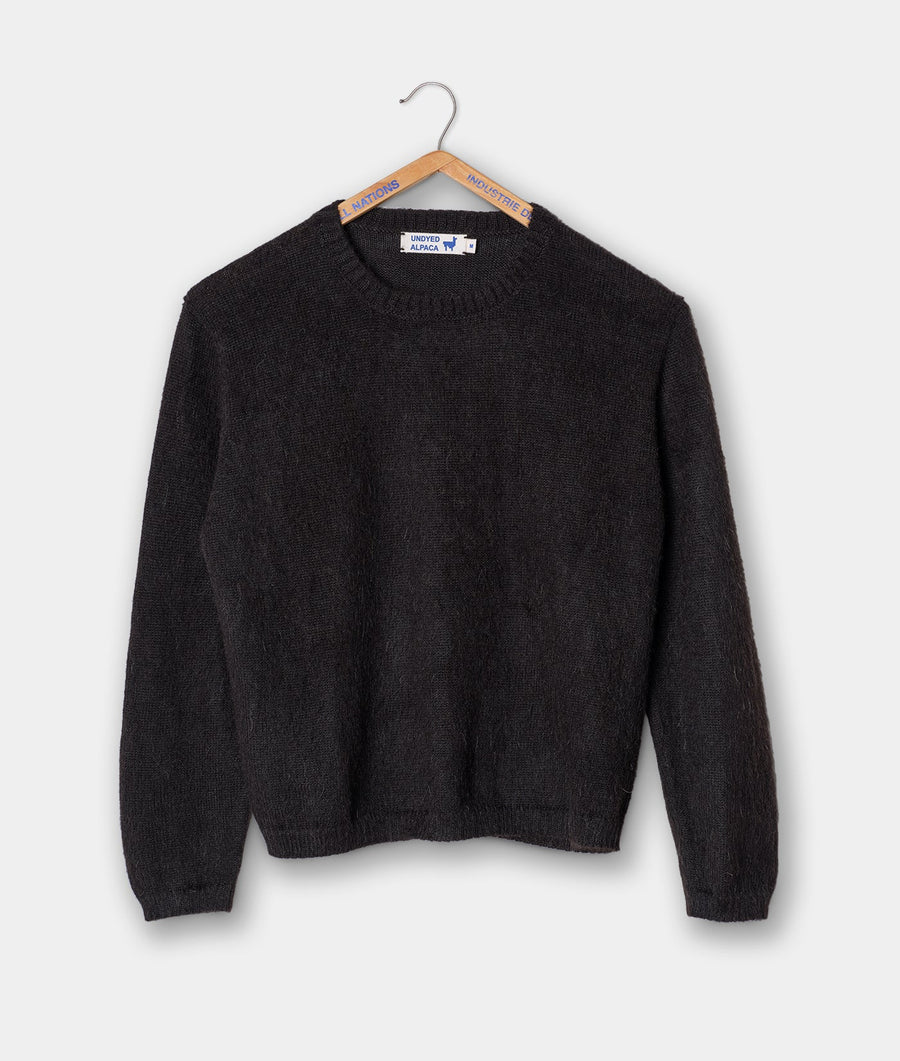 Black alpaca crewneck sweater displayed on a wooden hanger - Industry of All Nations