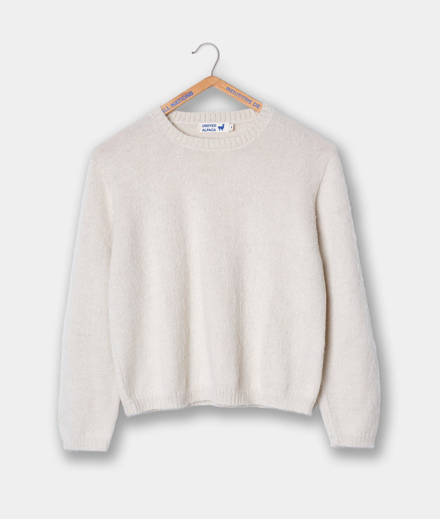 White knit sweater hanging on hanger with Industry of All Nations branding - Industry of All Nations