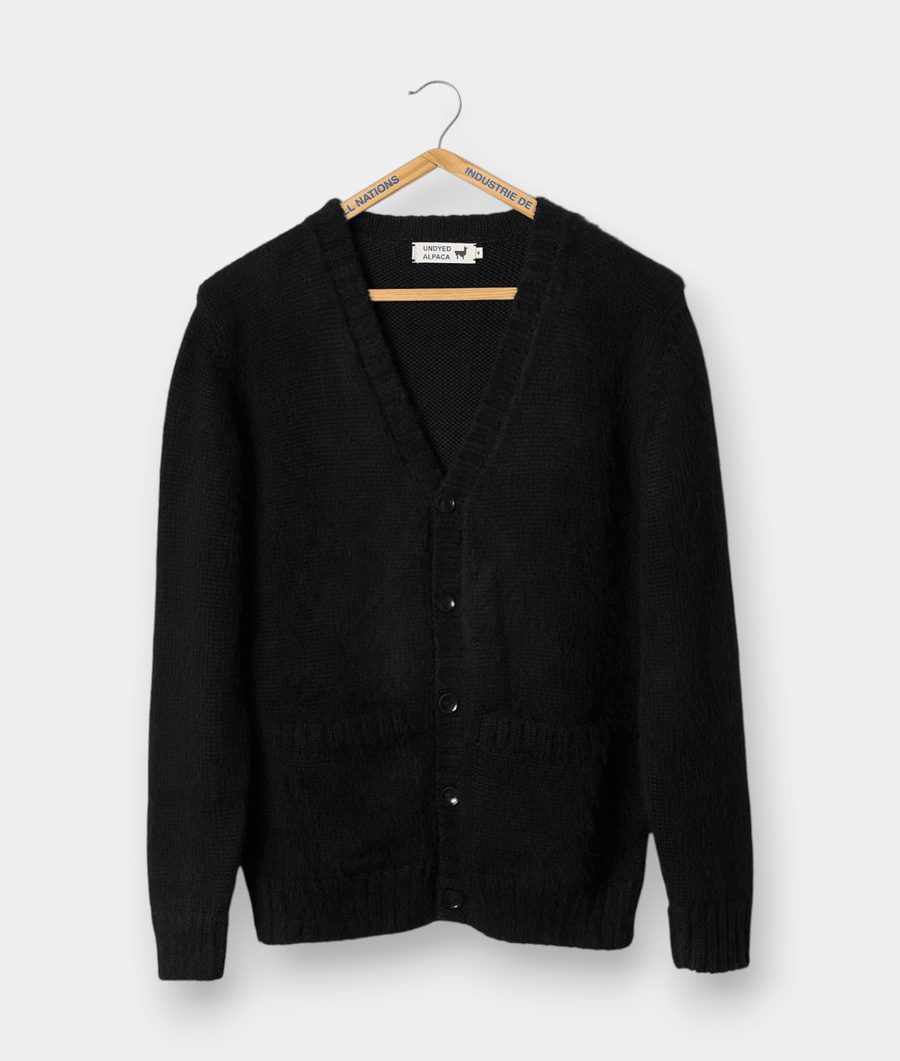 Black button-up cardigan sweater, hung on a wooden hanger against a white background - Industry of All Nations