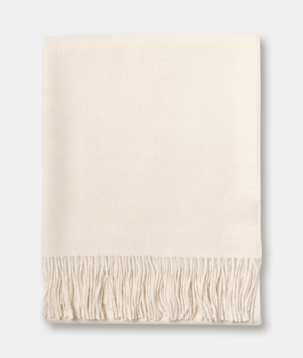 Beige fringe blanket or throw in a flat lay display - Industry of All Nations