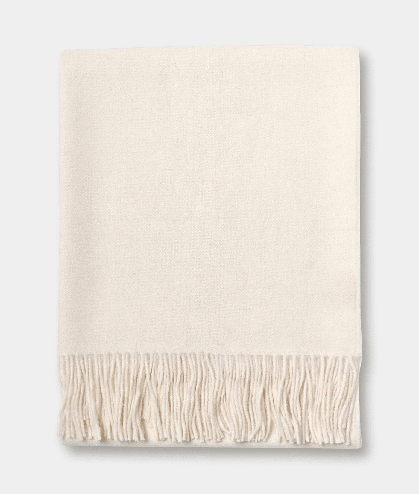 Beige fringe blanket or throw in a flat lay display - Industry of All Nations
