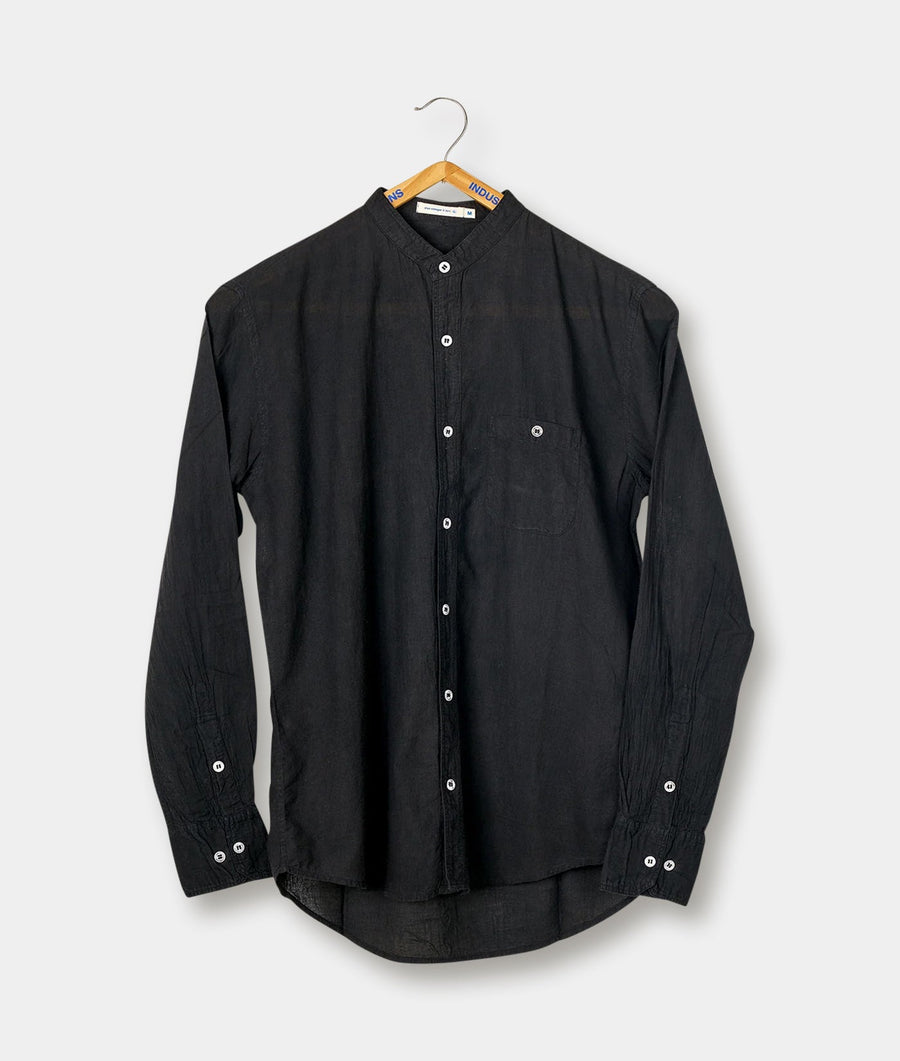 Black button-up shirt hanging on a wooden hanger - Industry of All Nations
