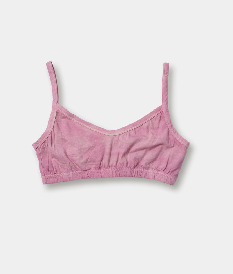 A light pink, sleeveless, brassiere-style crop top displayed flat against a white background - Industry of All Nations