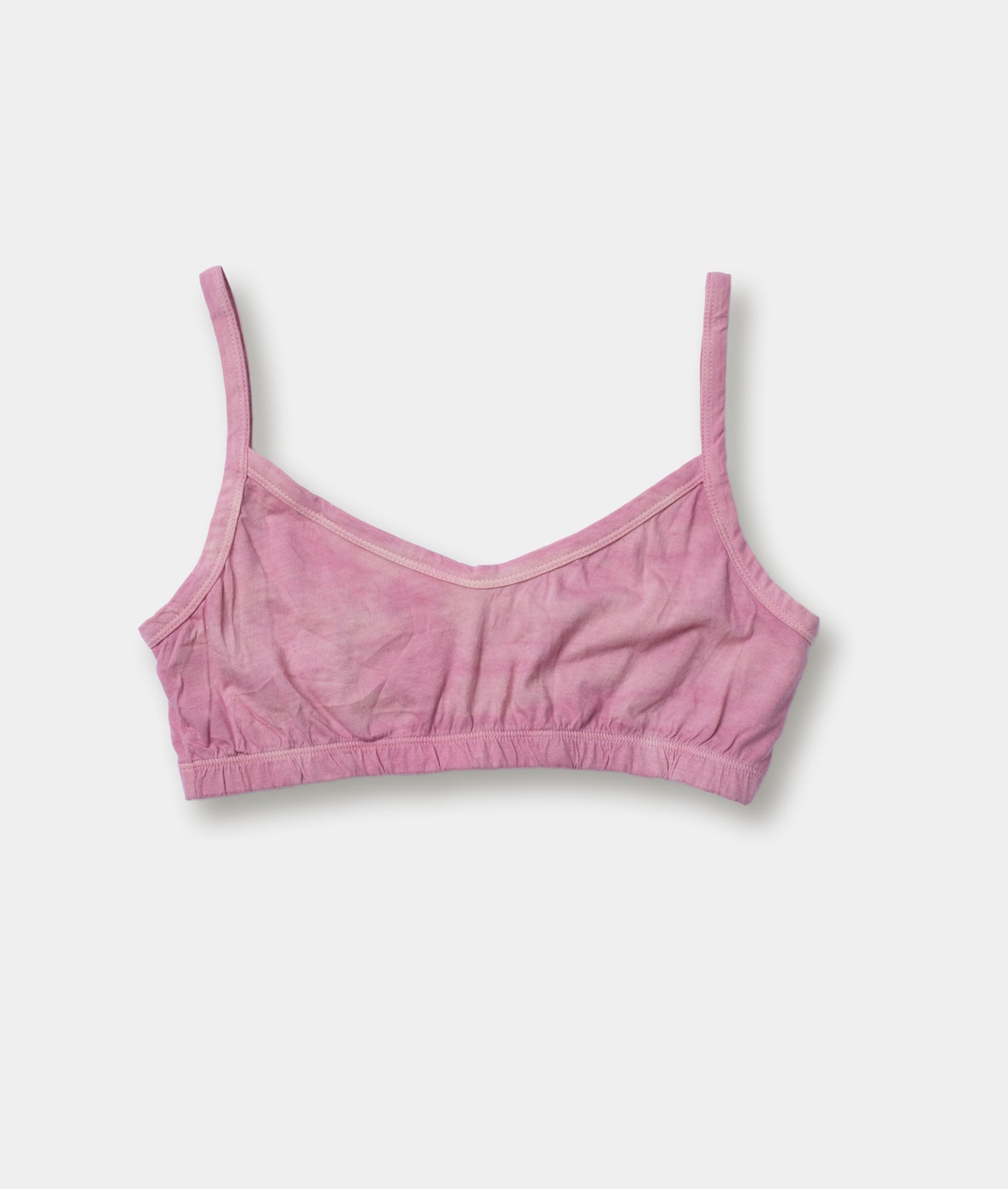 A light pink, sleeveless, brassiere-style crop top displayed flat against a white background - Industry of All Nations