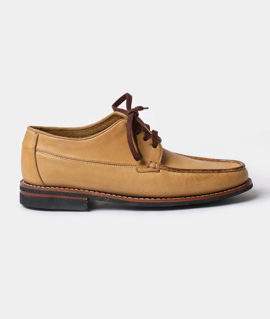 Tan leather lace-up moccasin-style shoes displayed in profile - Industry of All Nations