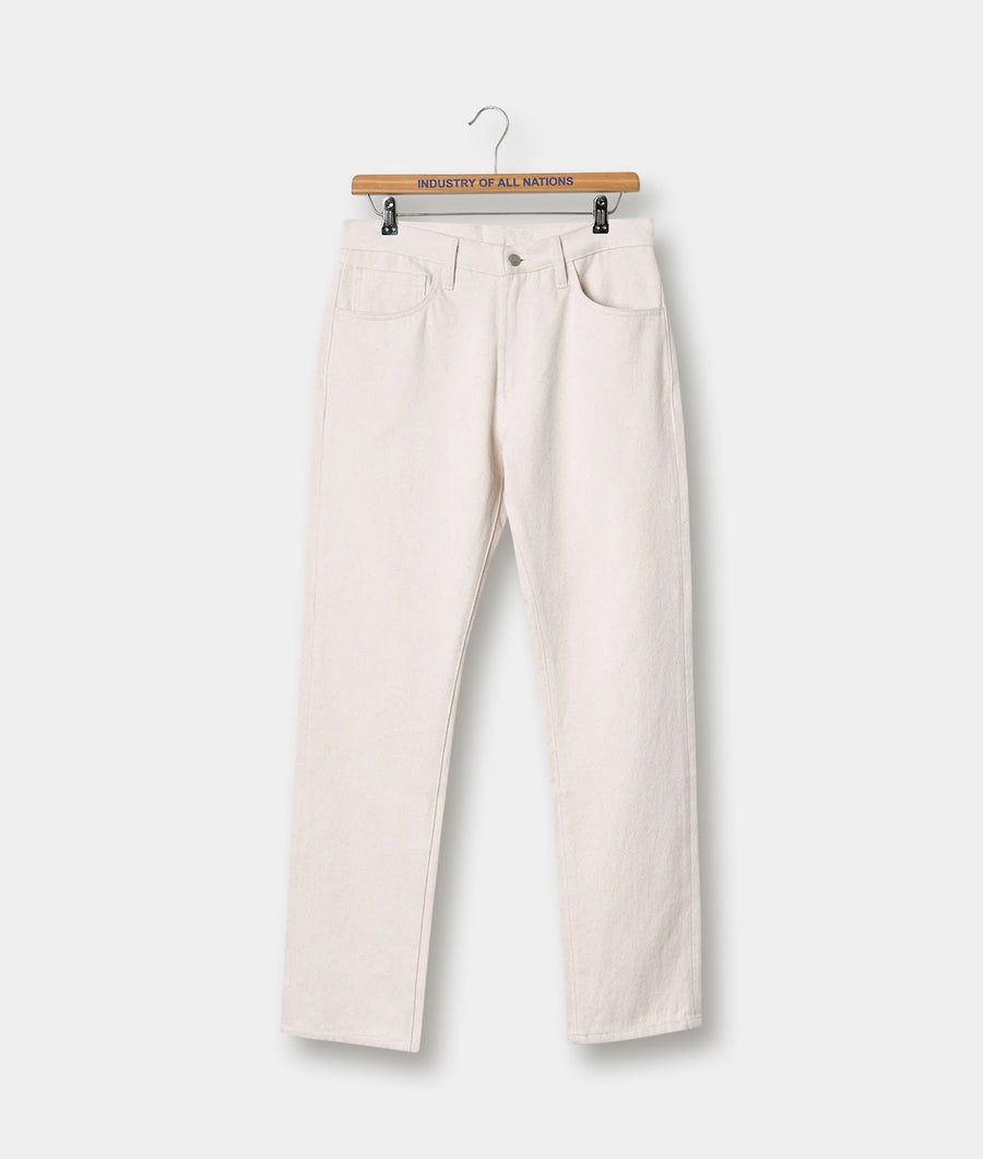 Pair of off-white straight leg jeans displayed on a wooden hanger with the brand's logo - Industry of All Nations.