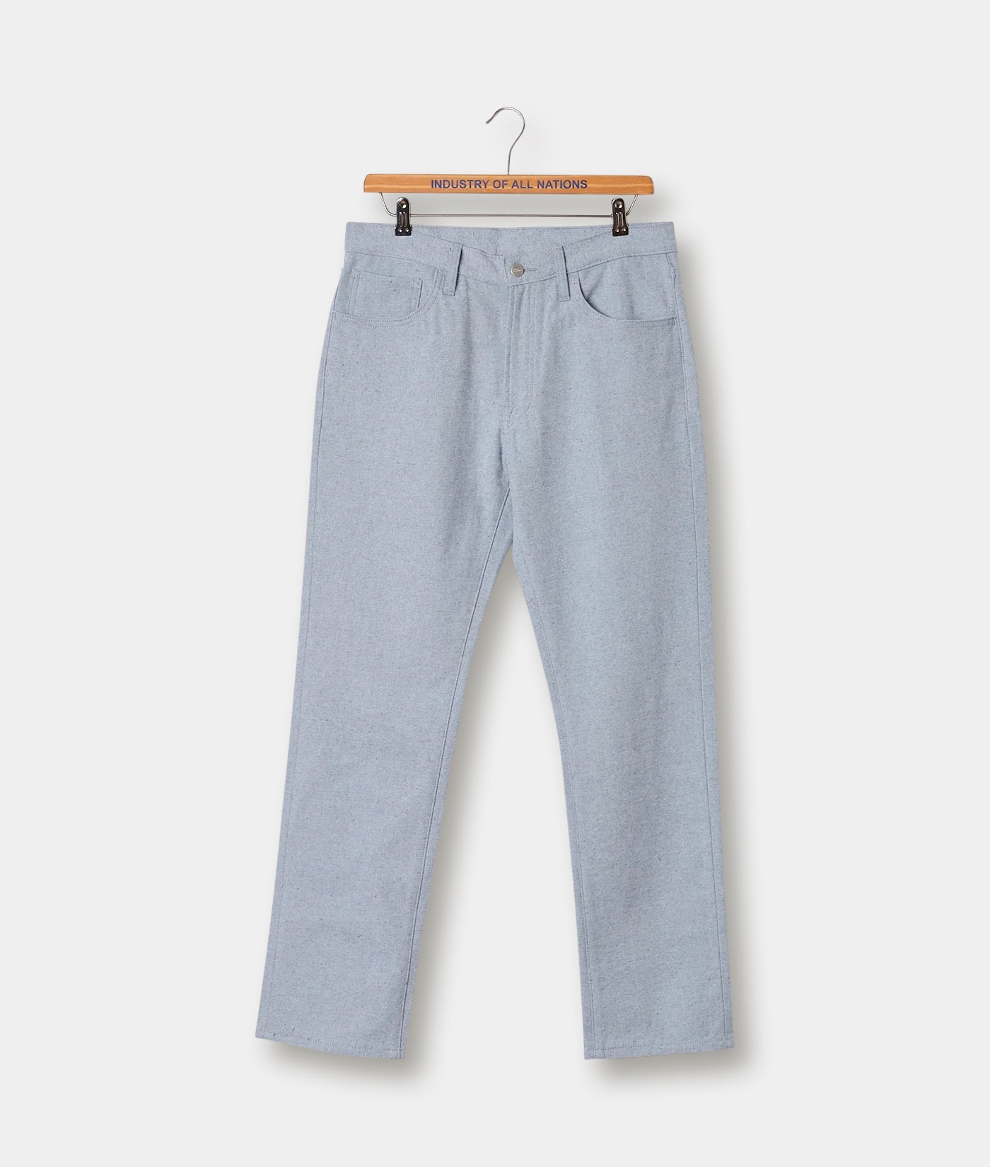 Gray cotton pants displayed on a hanger with a wooden "Industry of All Nations" label - Industry of All Nations