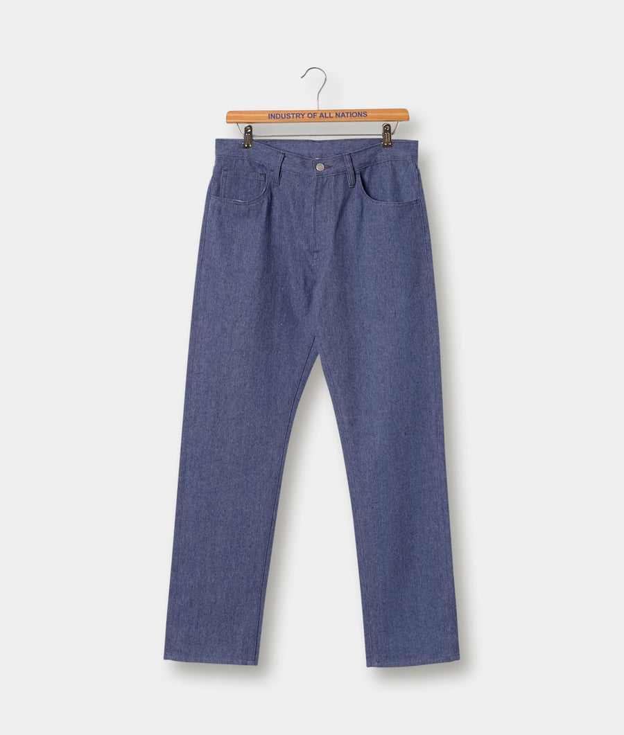Pair of medium-blue cotton denim pants, displayed on a wooden hanger with the brand's logo - Industry of All Nations