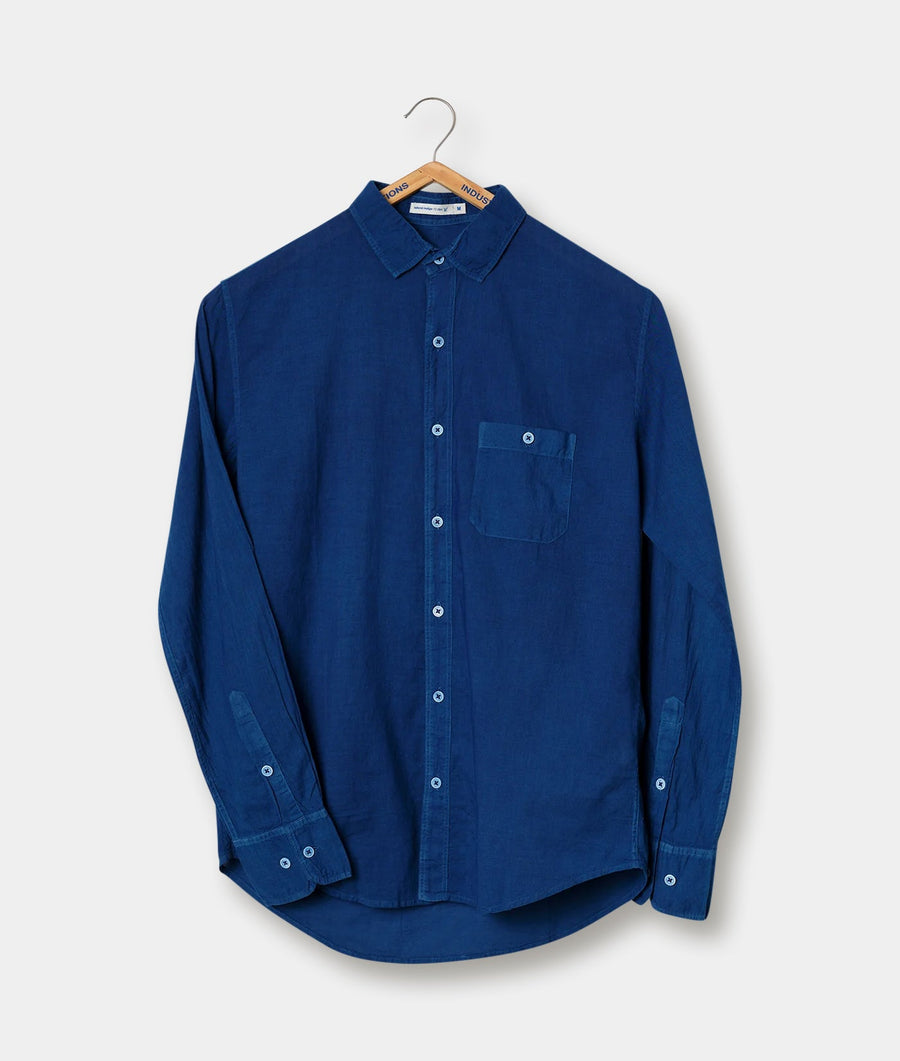 Navy blue button-down shirt with chest pocket, displayed on a hanger - Industry of All Nations