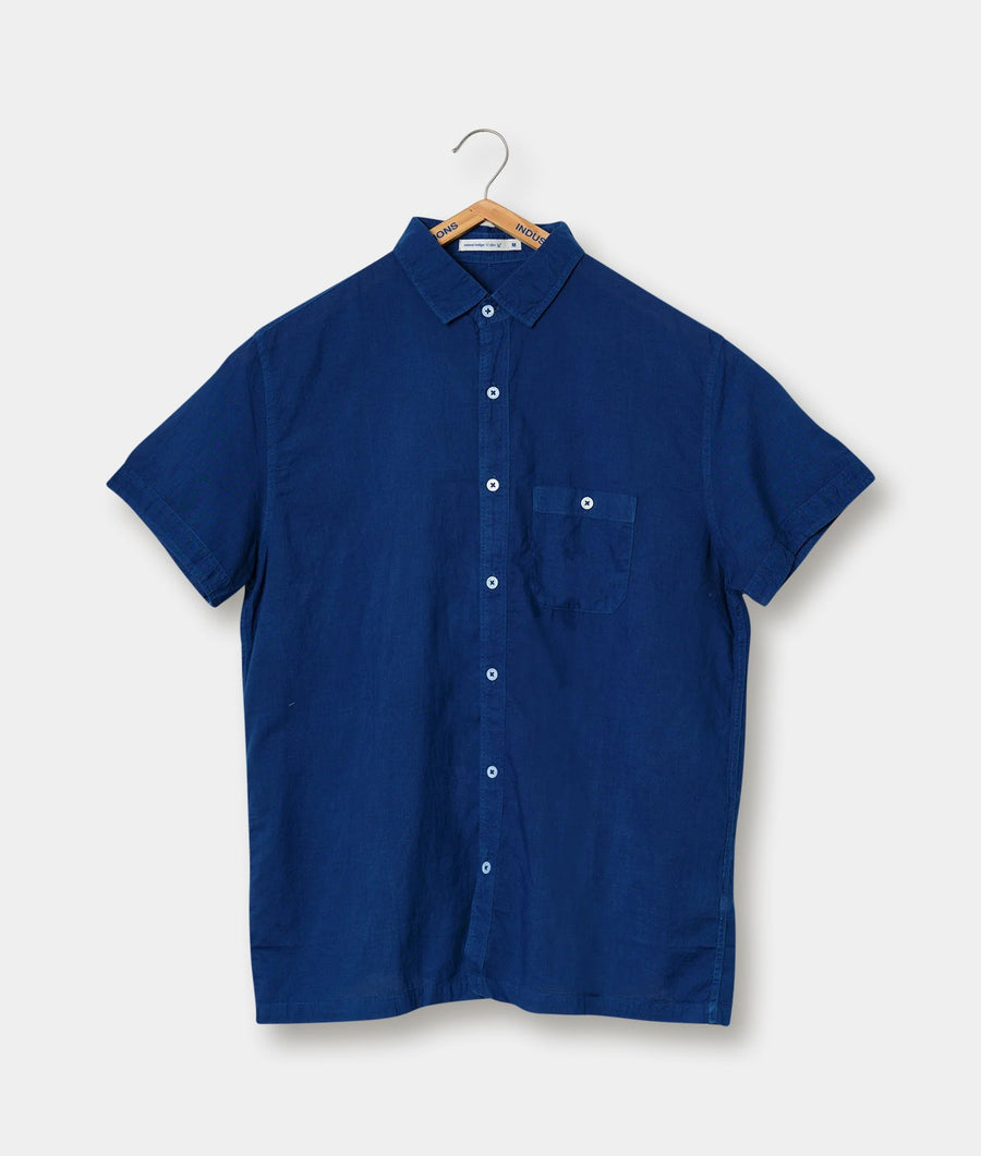 Navy blue short-sleeved button-up shirt displayed on a hanger - Industry of All Nations