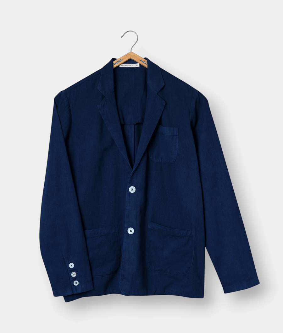 Navy blue cotton blazer/jacket displayed on a hanger - Industry of All Nations