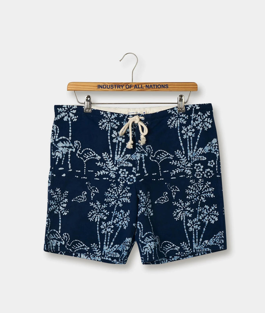 Navy blue cotton shorts with white floral print, displayed on a wooden hanger with the brand name "Industry of All Nations" - Industry of All Nations