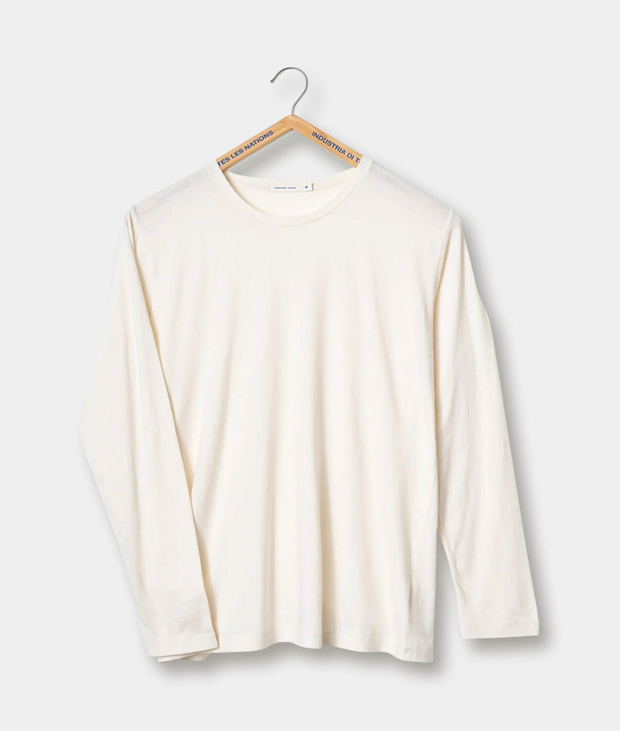 White long-sleeved shirt on a hanger with branding tags - Industry of All Nations