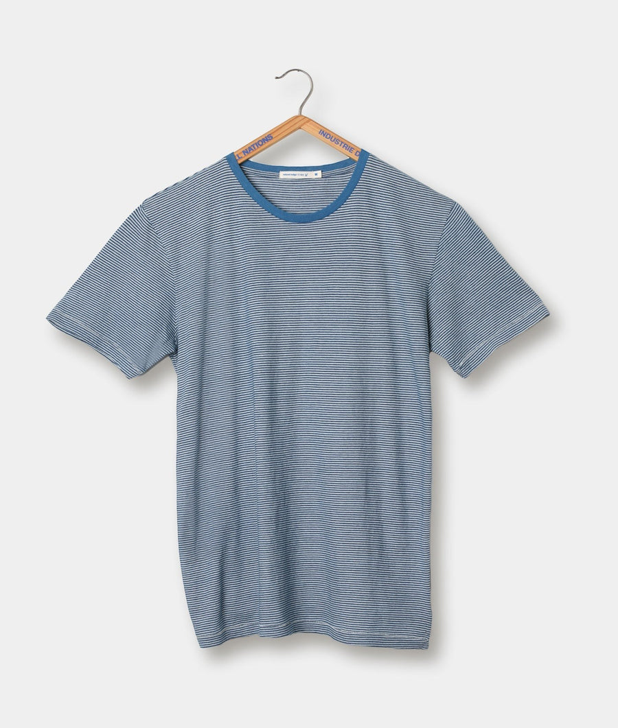 A blue and white striped t-shirt, displayed on a wooden hanger - Industry of All Nations