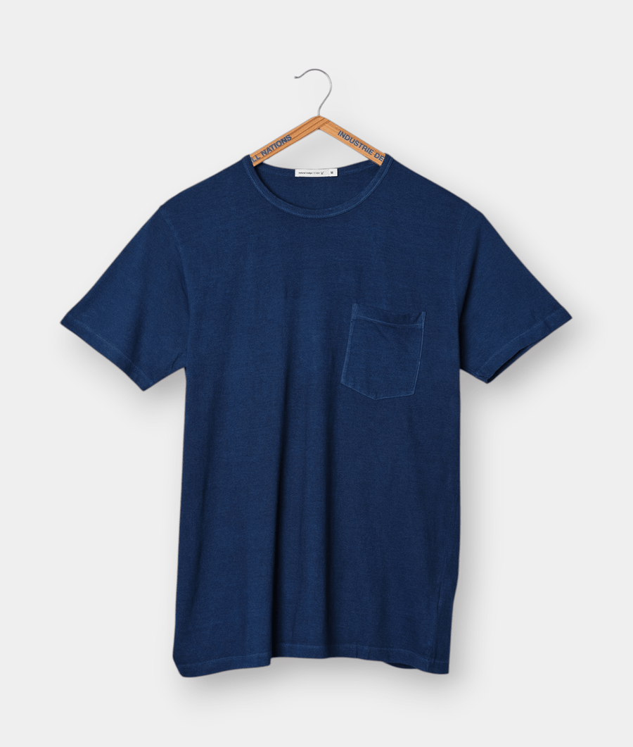 Navy blue t-shirt with front pocket displayed on a hanger - Industry of All Nations