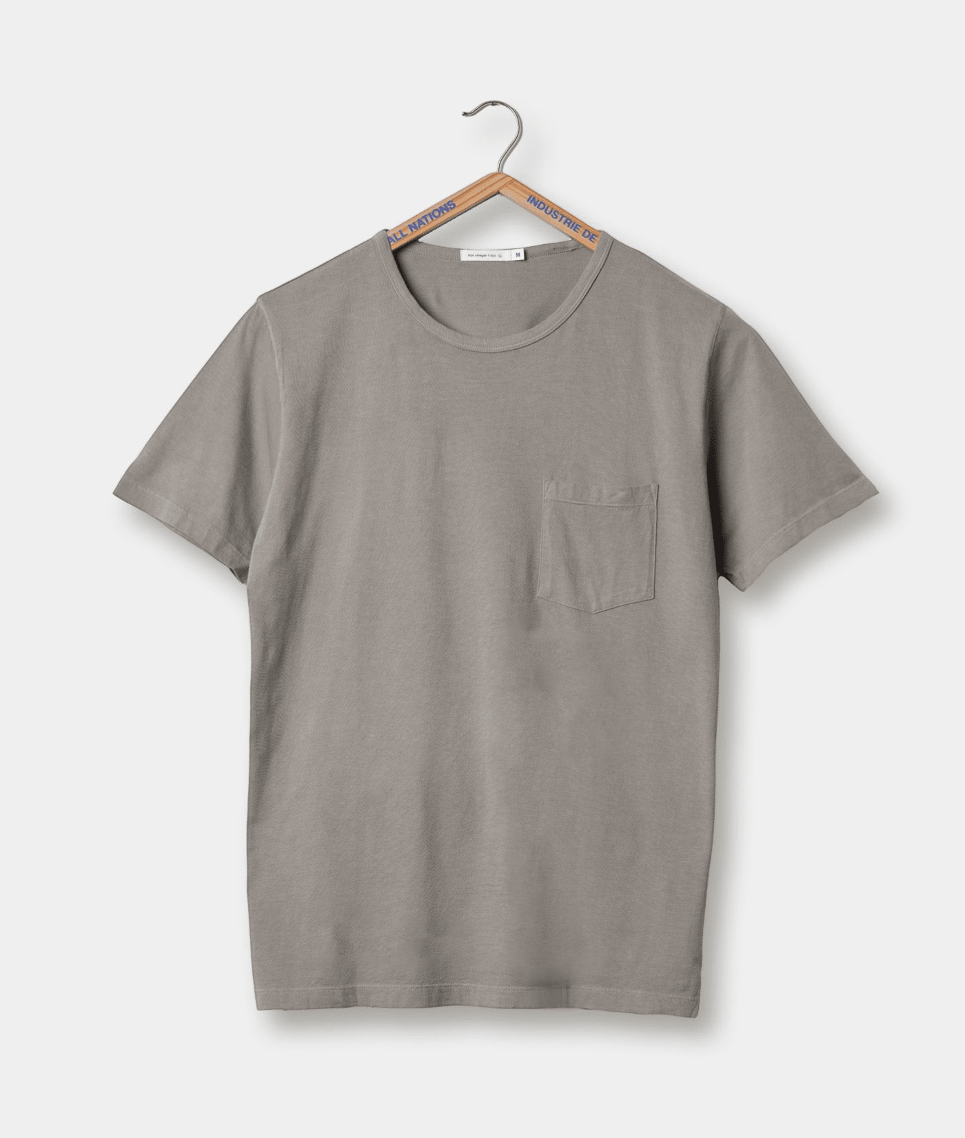 Gray crewneck T-shirt with a chest pocket, displayed on a wooden hanger against a white background - Industry of All Nations