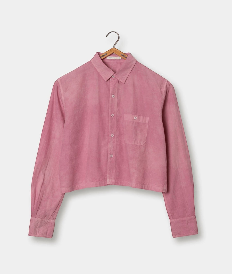 Pink collared button-up shirt hanging on a wooden hanger - Industry of All Nations