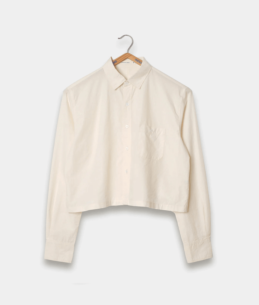 Cropped white cotton button-down shirt on wooden hanger - Industry of All Nations