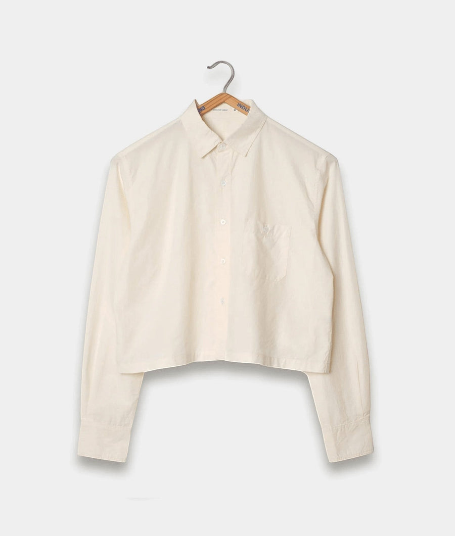 Cropped white cotton button-down shirt on wooden hanger - Industry of All Nations