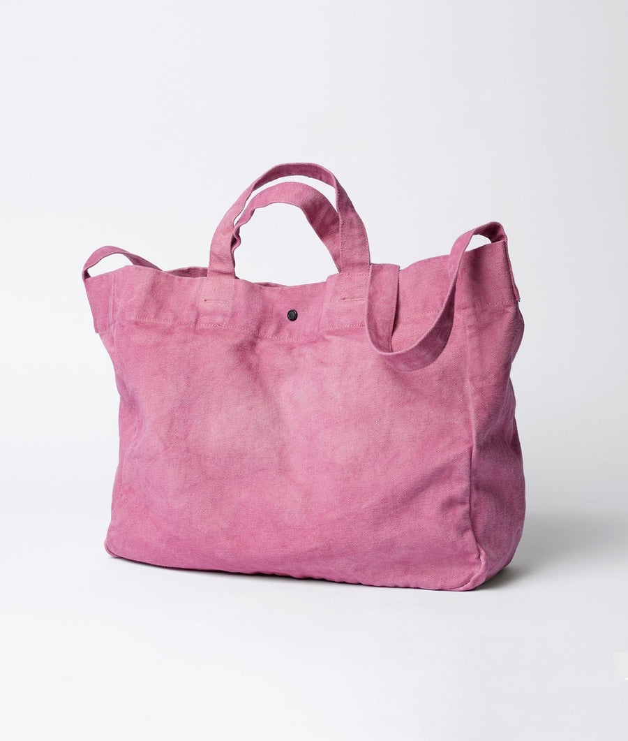 A pink cotton tote bag displayed on a white background - Industry of All Nations
