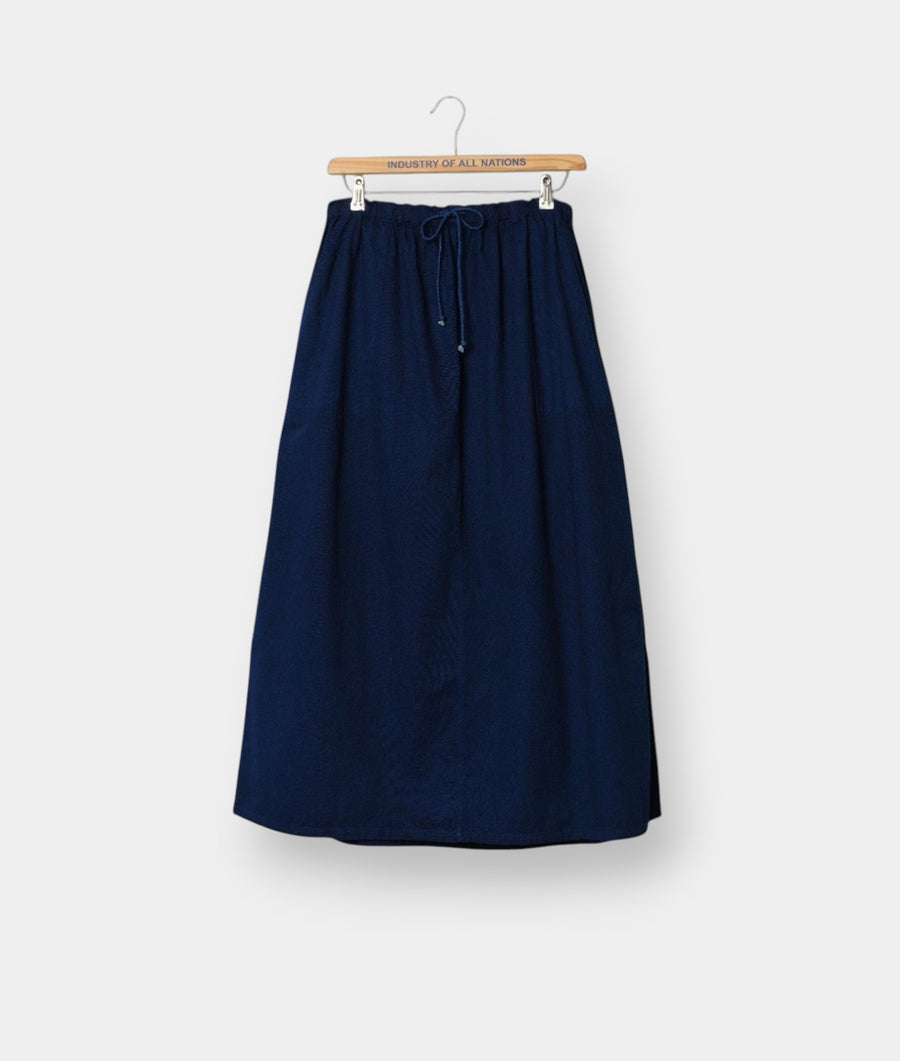 Industry of All Nations navy blue organic cotton Ponya maxi skirt with an adjustable drawstring waist.