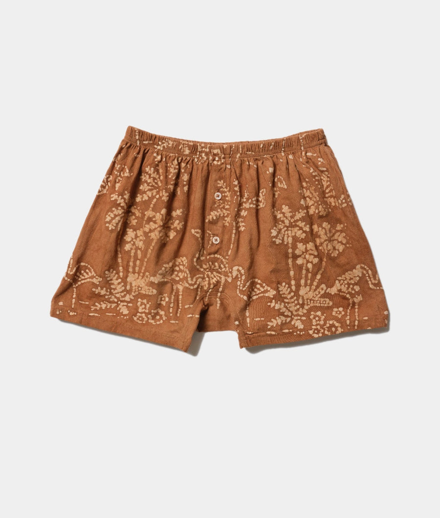 Patterned brown cotton shorts, displayed in a flat lay - Industry of All Nations