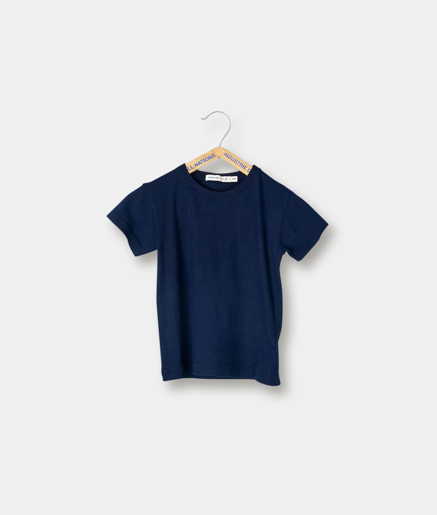 Dark navy blue short-sleeve t-shirt hung on hanger - Industry of All Nations