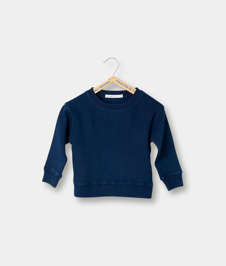 Navy blue crew neck sweatshirt for children, displayed on a wooden hanger against a plain white background - Industry of All Nations