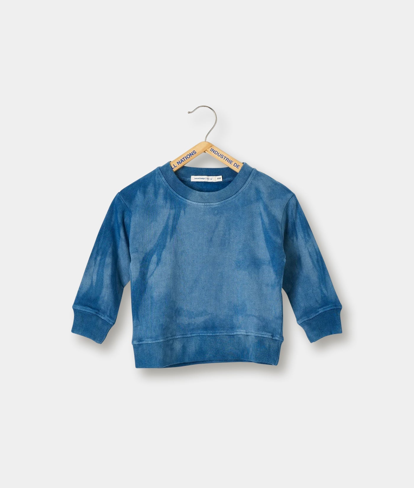 Blue tie-dye long sleeve crewneck sweatshirt displayed on a hanger - Industry of All Nations