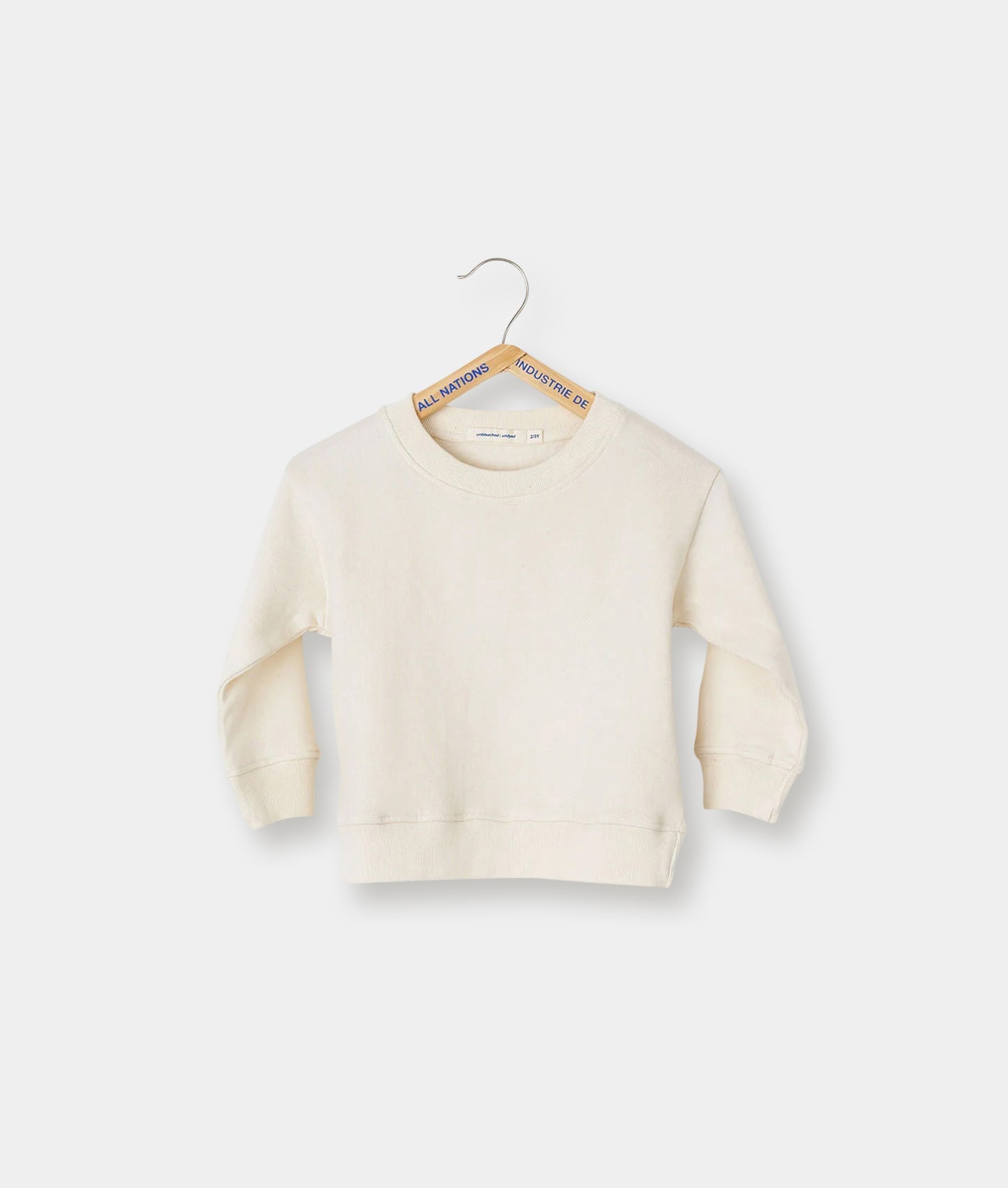 Cream-colored organic cotton crewneck sweatshirt displayed on a hanger - Industry of All Nations