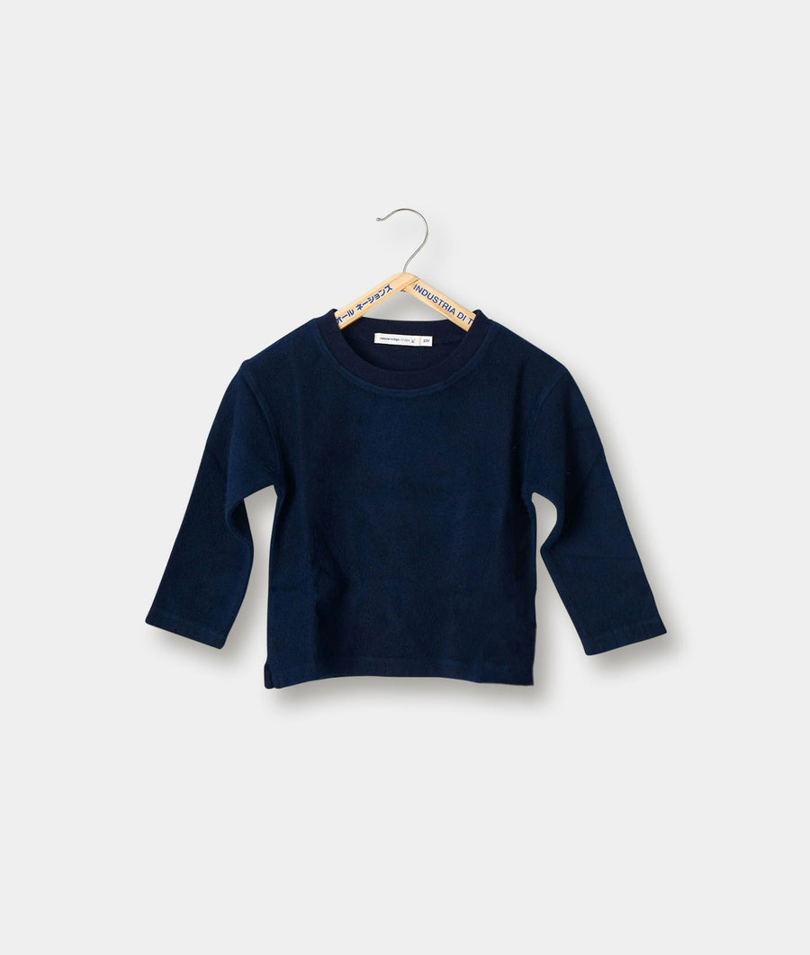Navy blue long-sleeved cotton t-shirt displayed on a hanger against a white background - Industry of All Nations