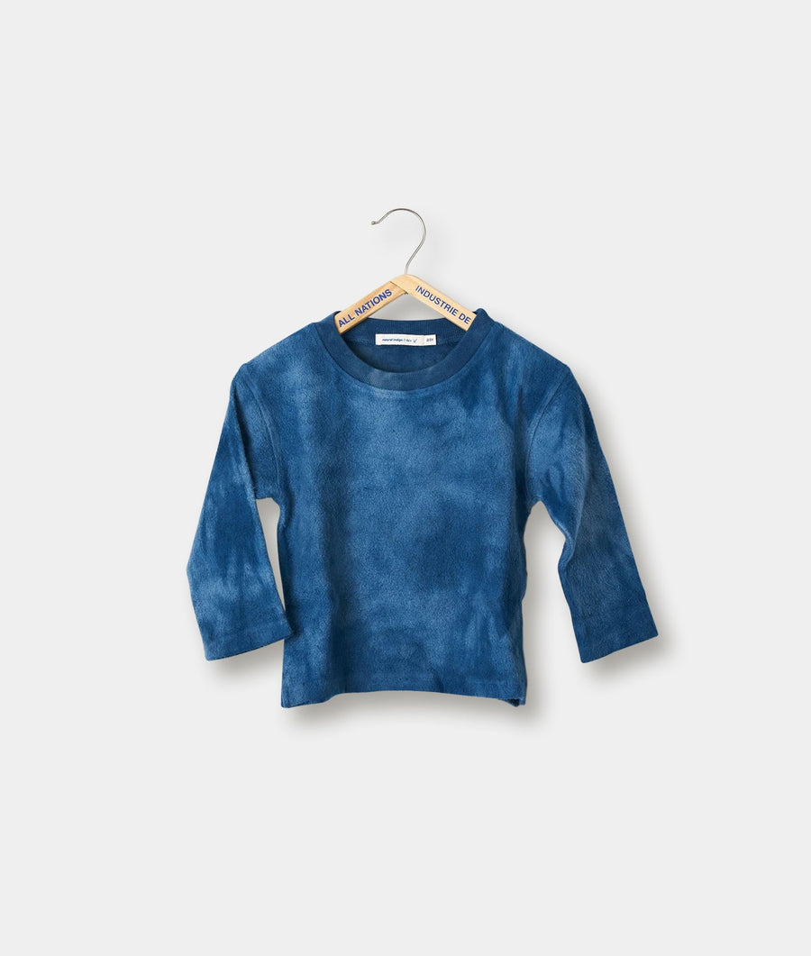 Long-sleeved blue tie-dye top displayed on a hanger - Industry of All Nations